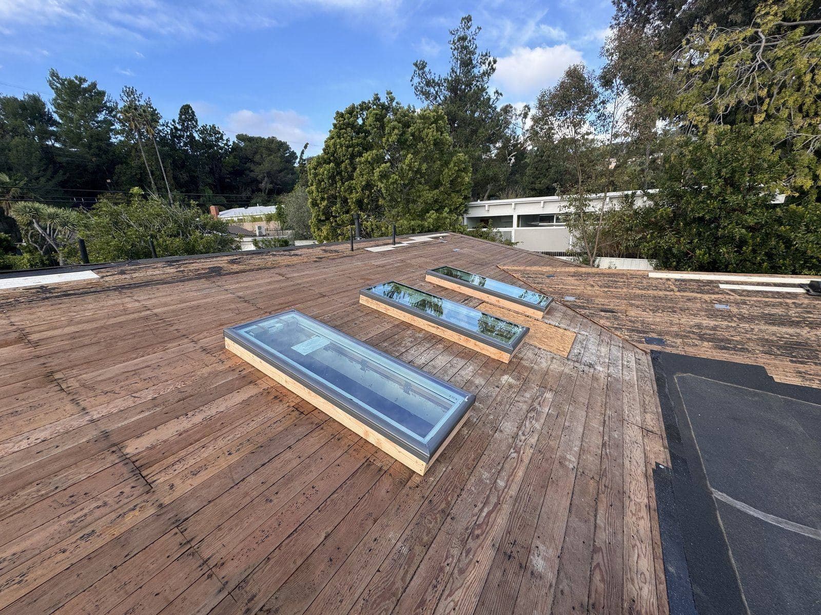 Three new skylights set in the roof deck, Buildda job in Brentwood
