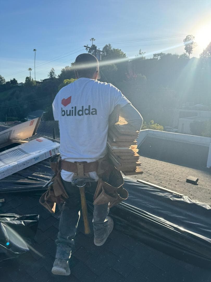 Roofing work at sunset
