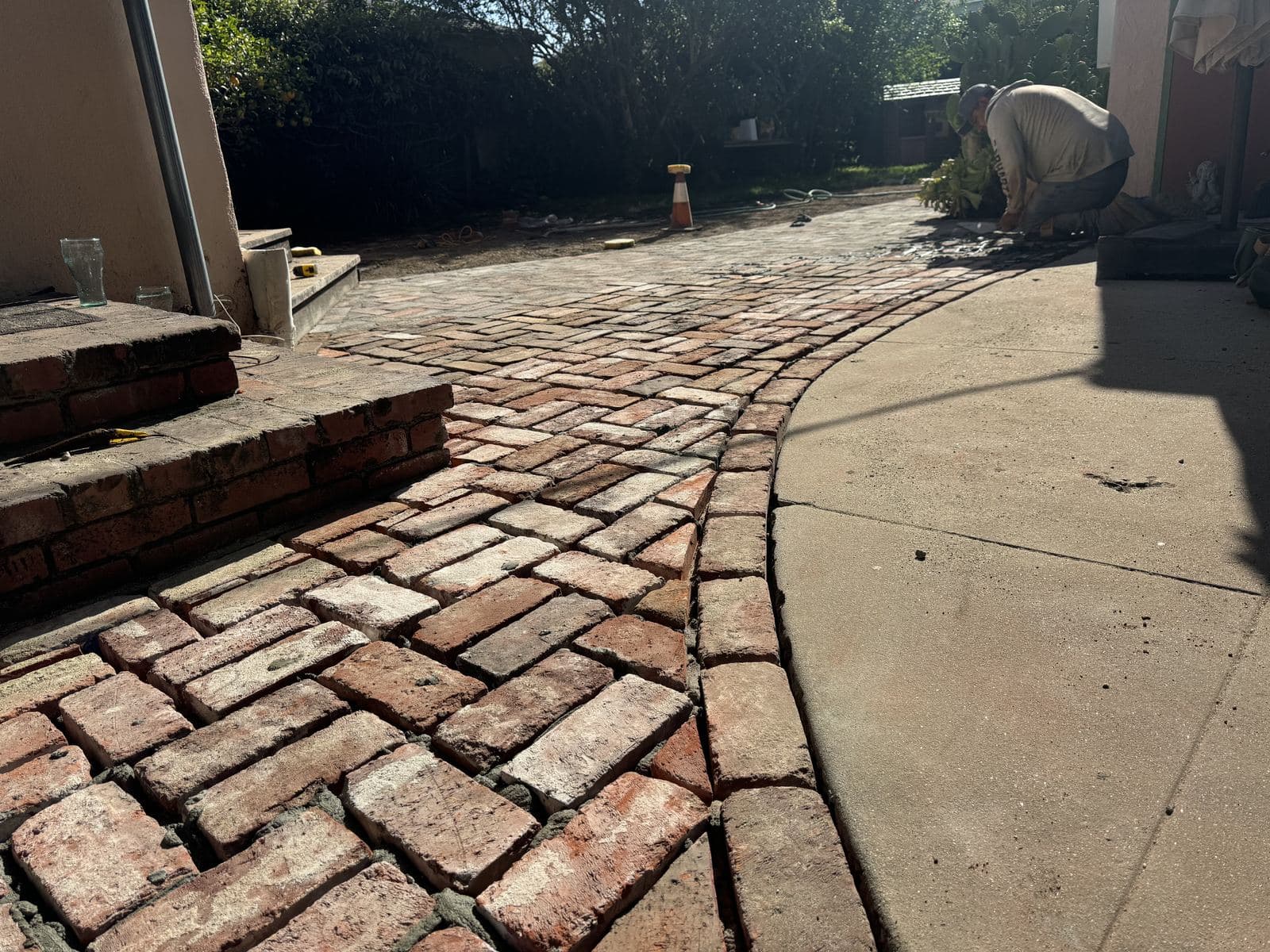 Old failing brick walkway along side of Culver City home before Buildda replacement