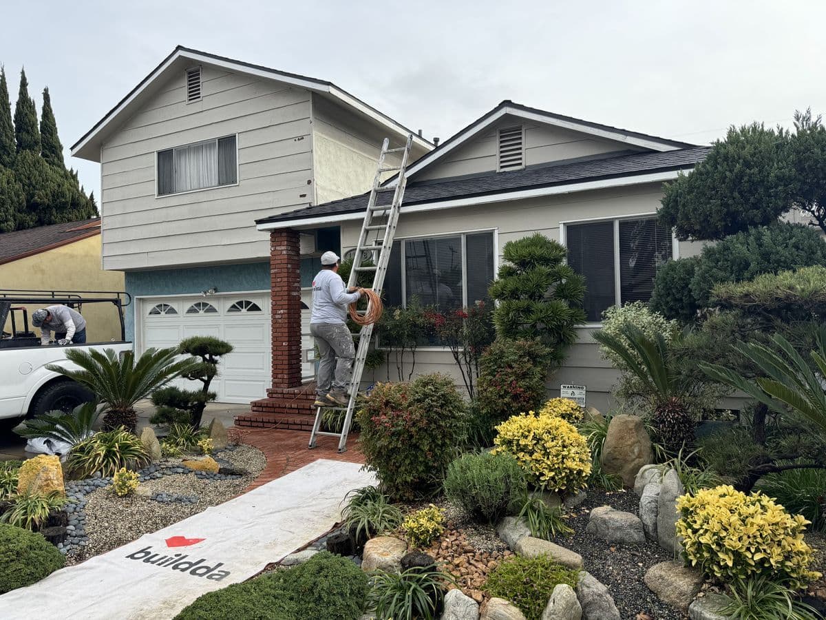 Culver City two-story home with professional Japanese landscaping during exterior trim painting project by Buildda