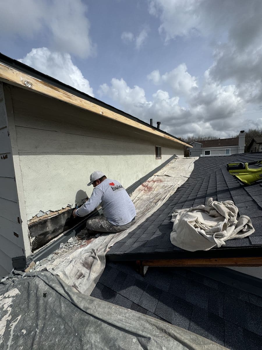 Stucco crack repair on second-story exterior wall during Culver City project